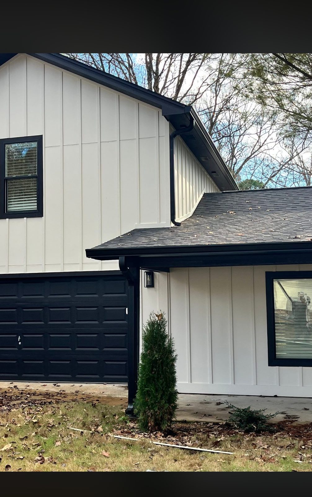 Matte black seamless gutters on a full-house install